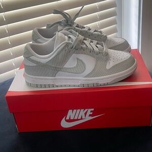 Elevate your child's sneaker game with these Nike Dunk Low GS shoes.